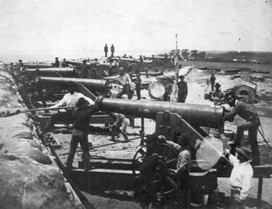 These heavy artillery guns near Pensacola were staffed by southern troops and were aimed at Union-held Fort Pickens cross Pensacola Bay in 1861. It is one of a significant group of photographs of southern soldiers in Florida made in 1861 by photographer J. D. Edwards of New Orleans. (Florida State Archives)