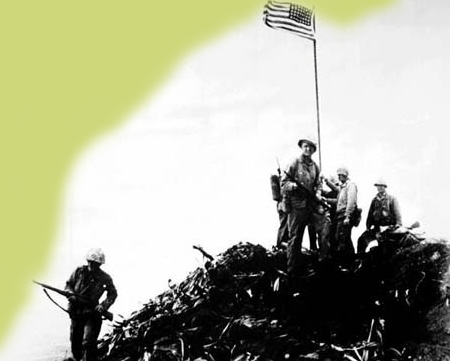 U.S. Marines gathered around the first American flag on Mount Suribachi on Iwo Jima
In the center of the photograph is Monticello native Sergeant Ernest I. 