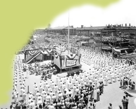 Workers and sailors gather at a Tampa shipyard, July 7, 1944